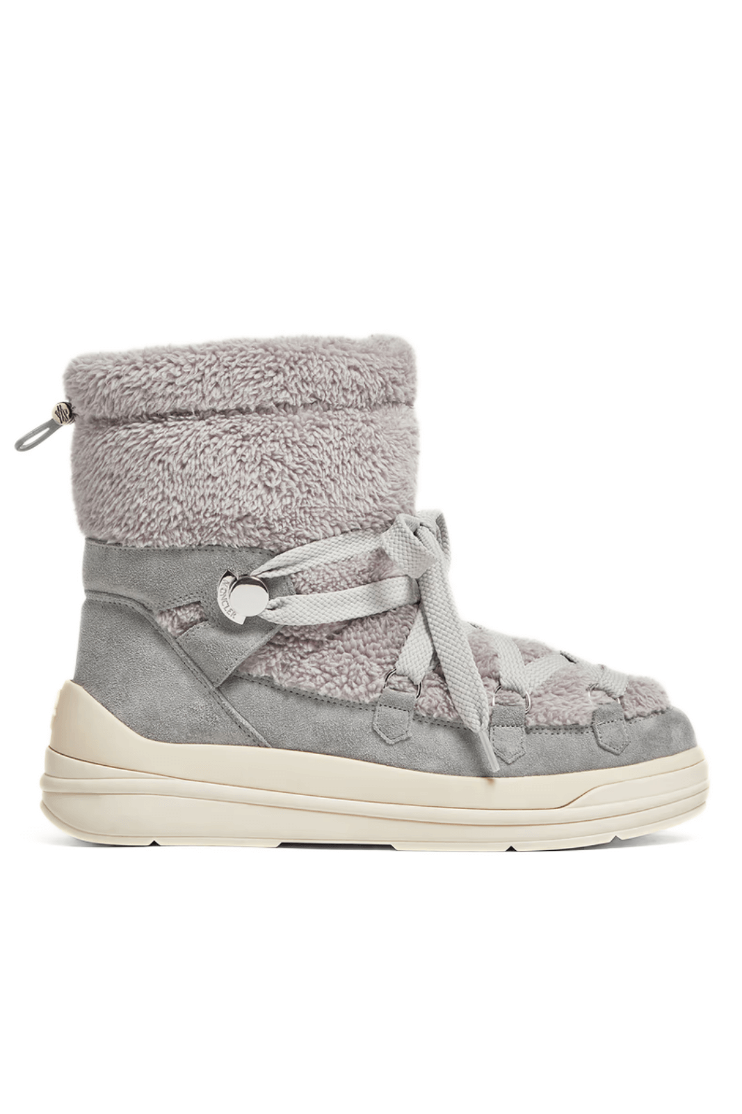 A pair of Moncler Insolux Suede Snow Boots in gray color with a plush design, featuring a lace-up closure and a rubber sole.
