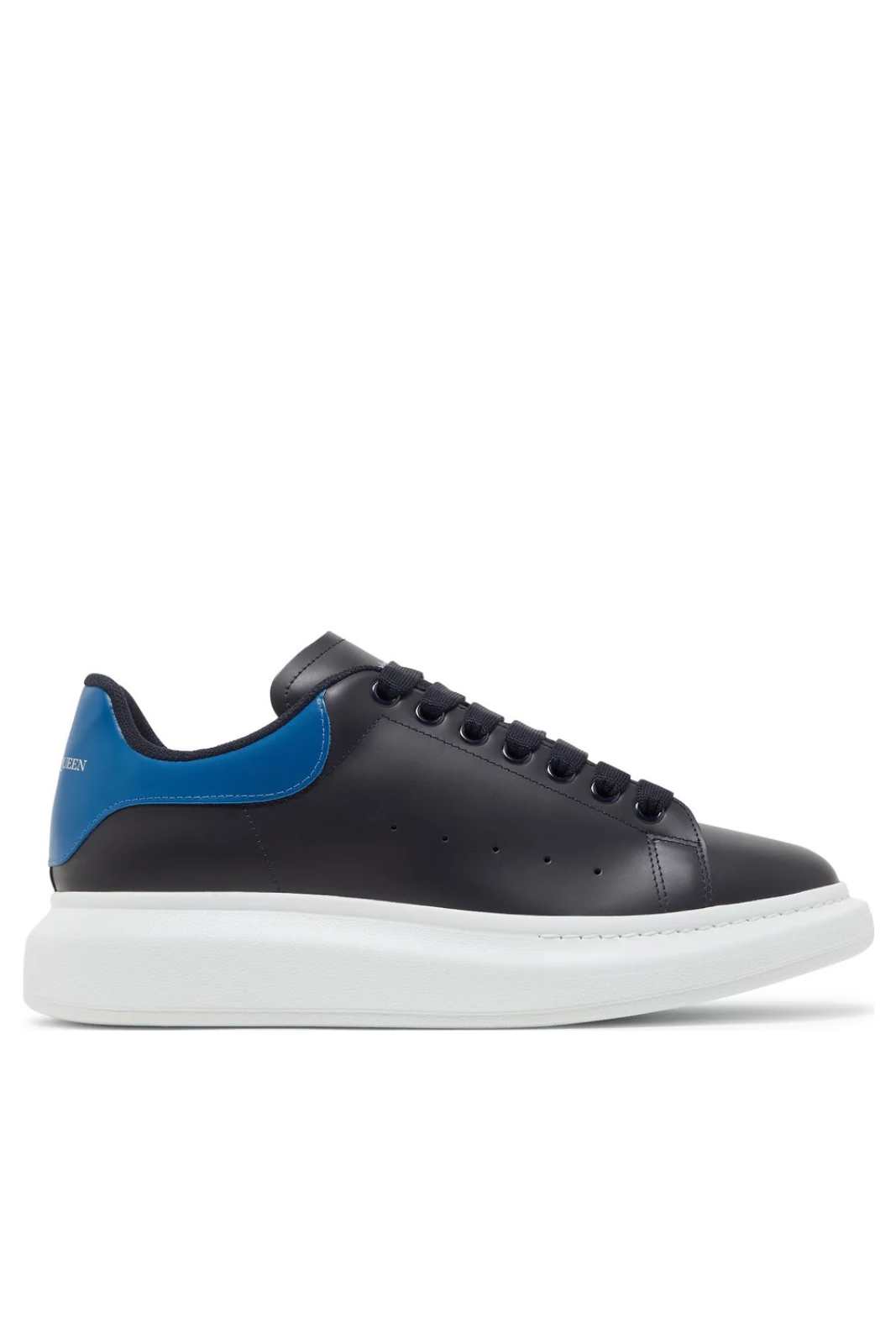 Alexander McQueen oversized sneaker in navy and ocean blue colors with a thick white sole and lace-up closure.